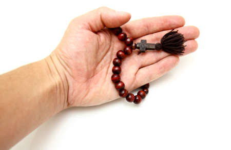  bead-roll with wooden elements isolated on white background In a hand