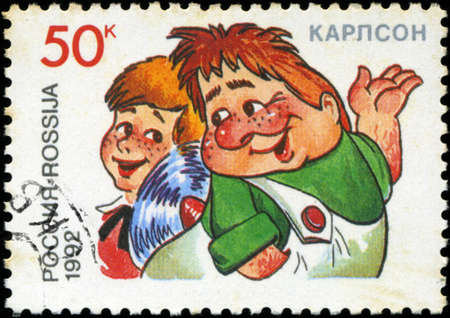 RUSSIA - CIRCA 1992: A stamp printed in Russia shows  Kid and Carlson, series Characters from Children's Books, circa 1992のeditorial素材
