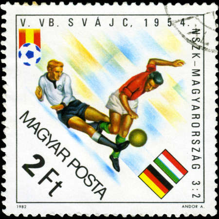 HUNGARY - CIRCA 1982: A stamp printed in Hungary, shows football players, inscription "Germany - Hungary 3:2, 1954", circa 1982のeditorial素材