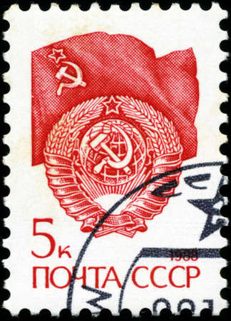 USSR - CIRCA 1988: A stamp printed in USSR shows State Emblem and flag of the Soviet Union , series...
