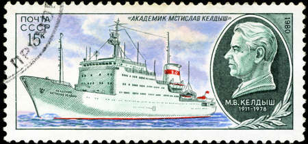 USSR - CIRCA 1980: A stamp printed in USSR (Russia) shows Portrait of a scientist and a ship his name with inscription Mstislav Keldysh, from the series Soviet Scientific Research Ships, circa 1980のeditorial素材