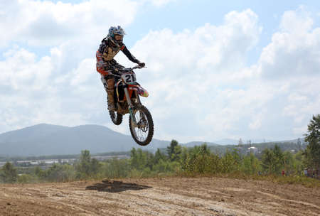 ARSENYEV, RUSSIA - AUG 30: Rider participates in the  round of the 2014 Russia motocross championship on August 30, 2014 in Arsenyev, Russia.のeditorial素材