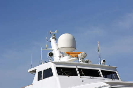 Ships antenna and navigation system in a clear blue sky.の写真素材
