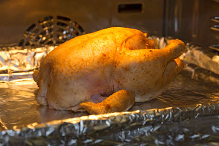 Cooking delicious of roasted chicken in the oven.