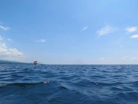 Traditional fishing boats floating on the sea Bali, Indonesia.