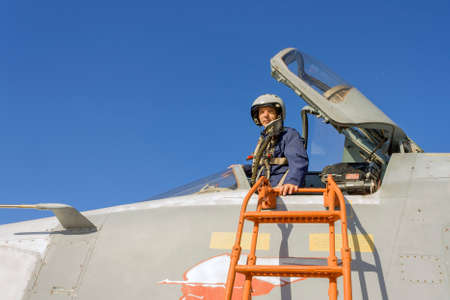 Military pilot in the cockpit of a jet aircraft.
