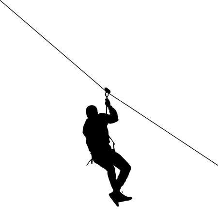 Silhouette of a man riding a zip line