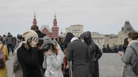 MOSCOW - MAY 27 2019: Excursion for tourists to historical places using VR helmets and virtual reality Moscow Kremlin on Red Square on May 27, 2019 in Moscow, Russia.のeditorial素材
