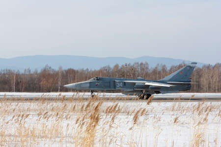Military jet bomber Su-24 Fencer afterburner takeoff.
