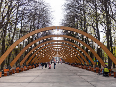 MOSCOW, RUSSIA - MAY 7, 2022 Sokolniki park, sunny autumn day wooden arch.のeditorial素材