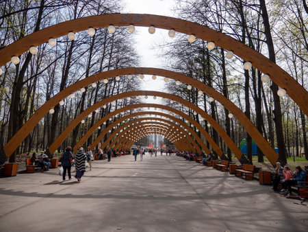 MOSCOW, RUSSIA - MAY 7, 2022 Sokolniki park, sunny autumn day wooden arch.のeditorial素材