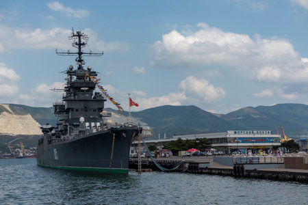 Novorossiysk, Russia - 18 August 2023. Cruiser Mikhail Kutuzov and dolphins, Black Sea, port, Krasnodar Territory, Novorossiyskのeditorial素材