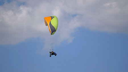 MOSCOW REGION, CHERNOE AIRFIELD 22 May 2021: Powered parachute against the blue sky aviation festival, theory and practice.の写真素材