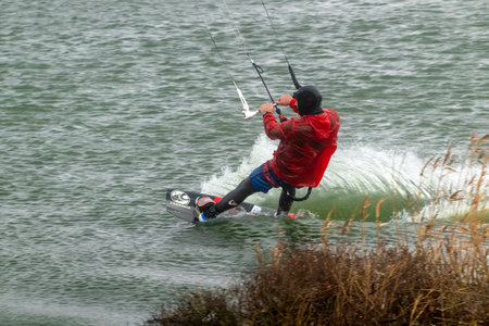 A kite surfer rides and jumps the waves the black sea.の写真素材