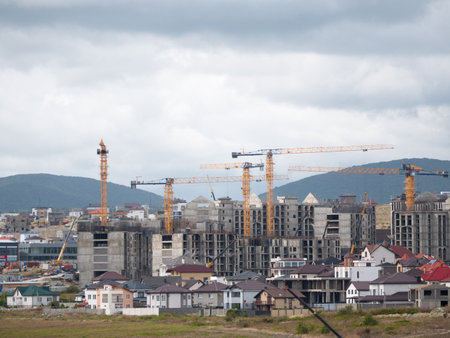 Novorossiysk many hoisting cranes and buildings under construction.の写真素材