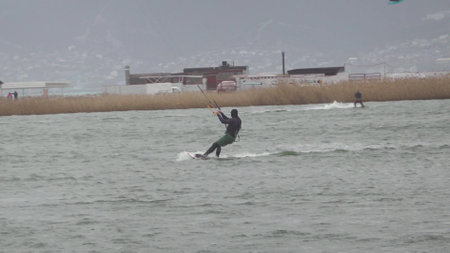 Novorossiysk, Russia 08.18.2023 kite surfer rides and jumps the waves the black sea.の写真素材
