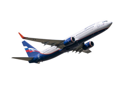 MOSCOW , RUSSIA, June 10, 2020: The Commercial passenger airplane flying overhead on sunny day on...