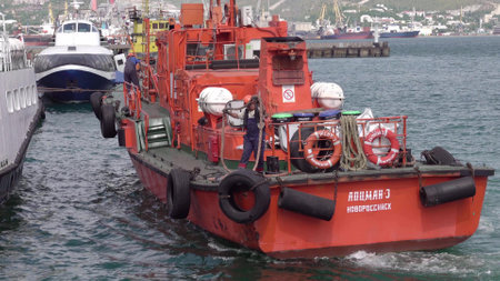 Novorossiysk, Russia - 18 August 2023. red port ship name Locman 3 in the port of Novorossiysk Black Sea.のeditorial素材
