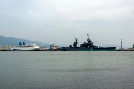 Novorossiysk, Russia - 18 August 2024 Cruiser Mikhail Kutuzov and dolphins, Black Sea, port, Krasnodar Territory, Novorossiyskのeditorial素材