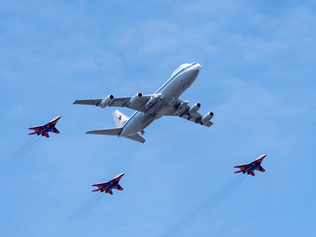 MOSCOW, RUSSIA - MAY 7, 2022: Avia parade in Moscow. MiG-29 and strategic bomber and missile platform IL-86 in the sky on parade of Victory in World War II in Moscow, Russia.のeditorial素材