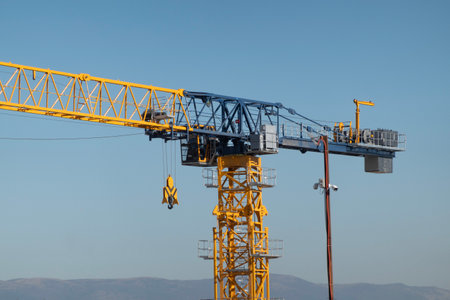 Novorossiysk Two hoisting cranes and buildings under construction.のeditorial素材