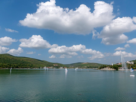 Abrau Durso, Russia 28 August 2024: Panoramic view of the lake Abrau-Durso with sailboats on a sunny day.の写真素材