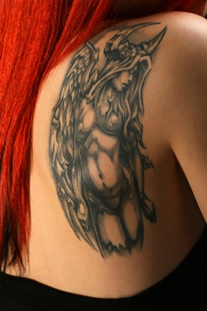 Sexy red hair girl with beautiful tatooの写真素材