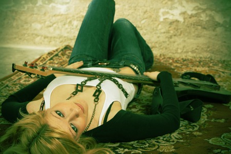 Woman with a acoustic guitarの写真素材