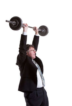 Mature Businessman Lifting Barbell Over White Backgroundの写真素材