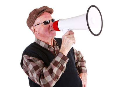 Senior Man Shouting Through Megaphone Over White Backgroundの写真素材