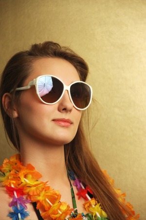 Girl with sunglesses and hawaiian wreathの写真素材