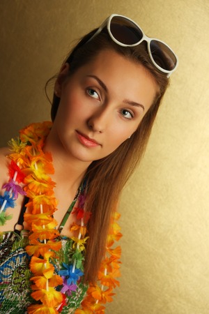 Girl with sunglesses and hawaiian wreathの写真素材
