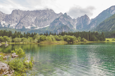 Beautiful Mountain Lake Landscape With Panoramic View Of Mountain Alps On Background At Summer.の写真素材
