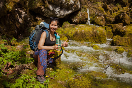 Pretty Asian Backpacker Hiking In Beautiful Forest At Summer.の写真素材