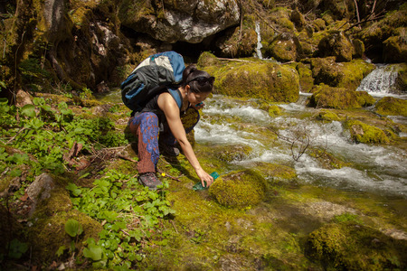 Pretty Asian Backpacker Hiking In Beautiful Forest At Summer.の写真素材