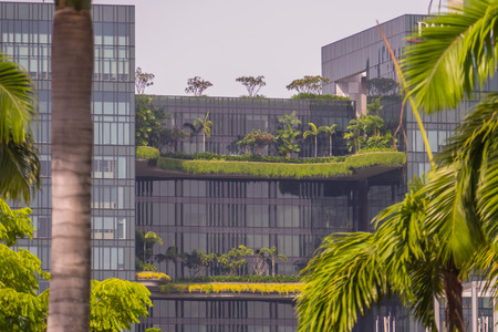 Singapore City, Singapore - 07 19 2015: Modern Glass Office Buildings With Green Trees In Singapore.のeditorial素材