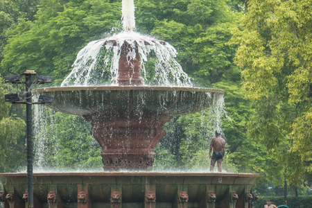 Male Indian Taking A Shower In The Fountain.の写真素材