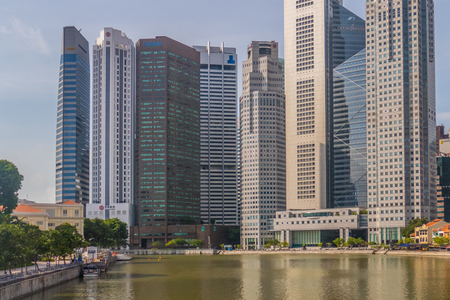 Singapore City, Singapore - 07 19 2015: Singapore Reflection Of Modern High Skyscraper Buildings And Its River At Day.のeditorial素材