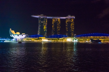 Singapore City, Singapore - 07 19 2015: View Of Famous Marina Bay Sands Hotel In Singapore Against  Sky At Night.のeditorial素材