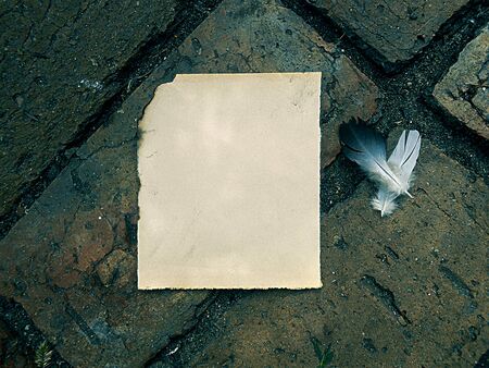 old burnt paper vintage on old masonryの写真素材