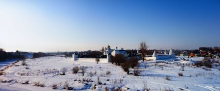Winter frosty day view of the old russian monastery. blue and white photo manipulation.の写真素材