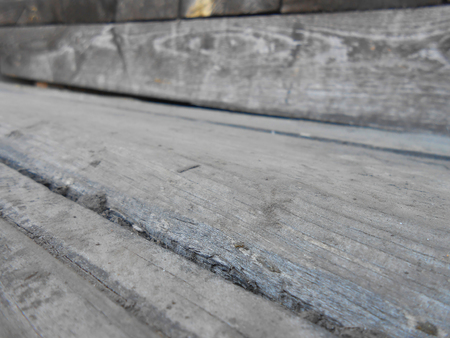 Old wooden porch, whipped from dark  planksの写真素材