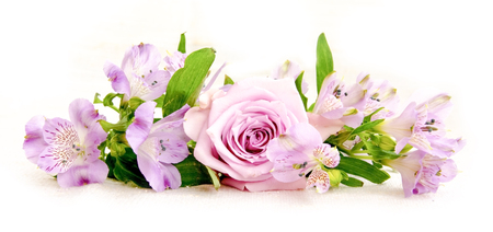 Beautiful bouquet of  pink alstroemeria and rose flower on linen clothの写真素材