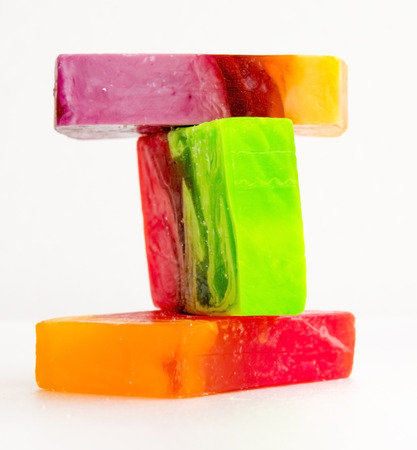 Piece of handmade bright soap. Close-up on a white backgroundの写真素材