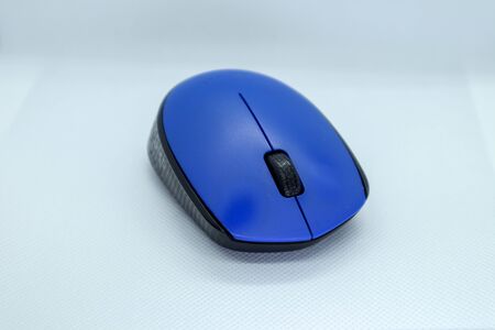 Simple blue compute mouse isolated on white backgroundの写真素材