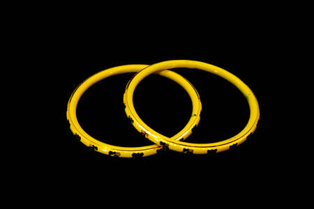 yellow color bangels on white isolated background indiaの写真素材