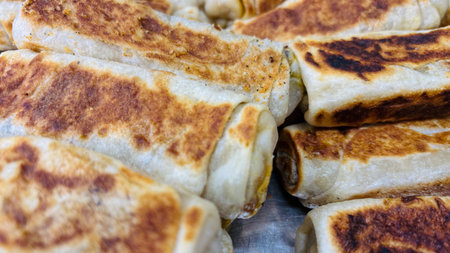 Close Up View Of Delicious Golden Brown Crispy Savory Beef Roti.