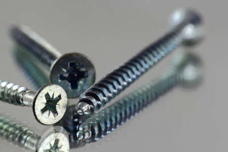 Screw on mirror.
