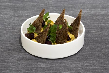 Turkey pate. Turkey breast fillet with onions, carrots and garlic with soy sauce, cream and thyme. Served with baked beets in aromatic oil, rye croutons and fresh parsley leaves.の写真素材