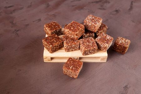 Healthy energy bars. Sweets made from natural organic dried fruits with nuts and coconut flakes....